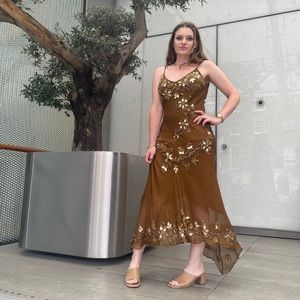 Dress with sewn in sequins and detail from London